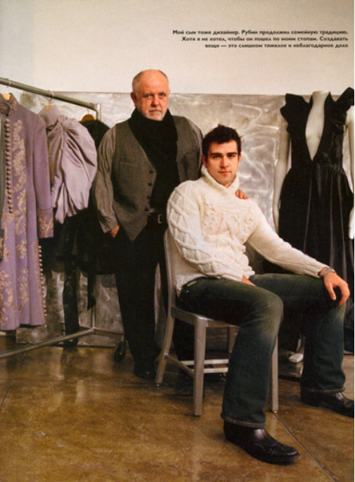 Two men pictured in a couture studio surrounded by gowns.