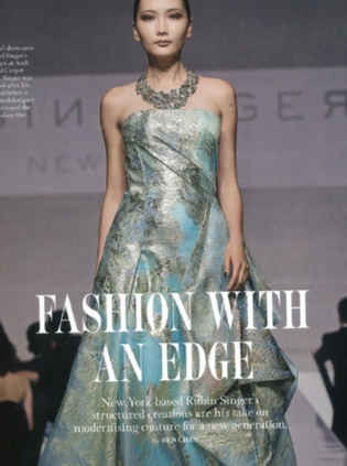 Fashion with an Edge editorial featuring a metallic blue strapless runway gown.