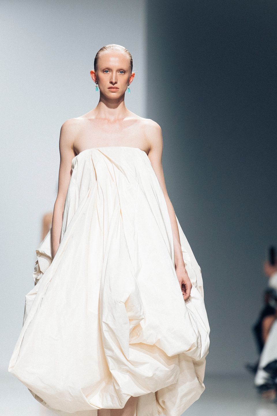 Model in a white strapless dress on the Rubin Singer Paris runway