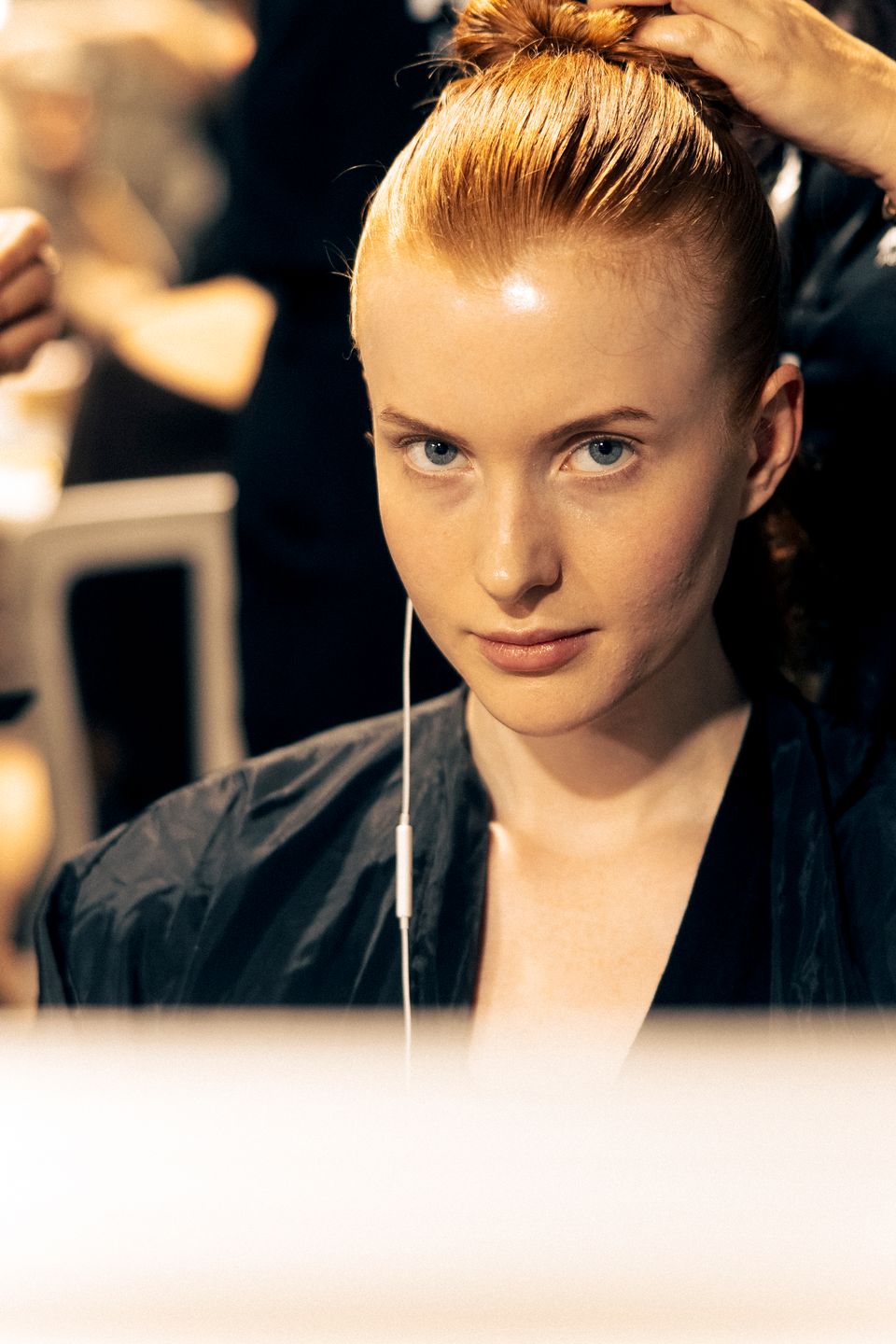 Backstage beauty preparations before the Paris show