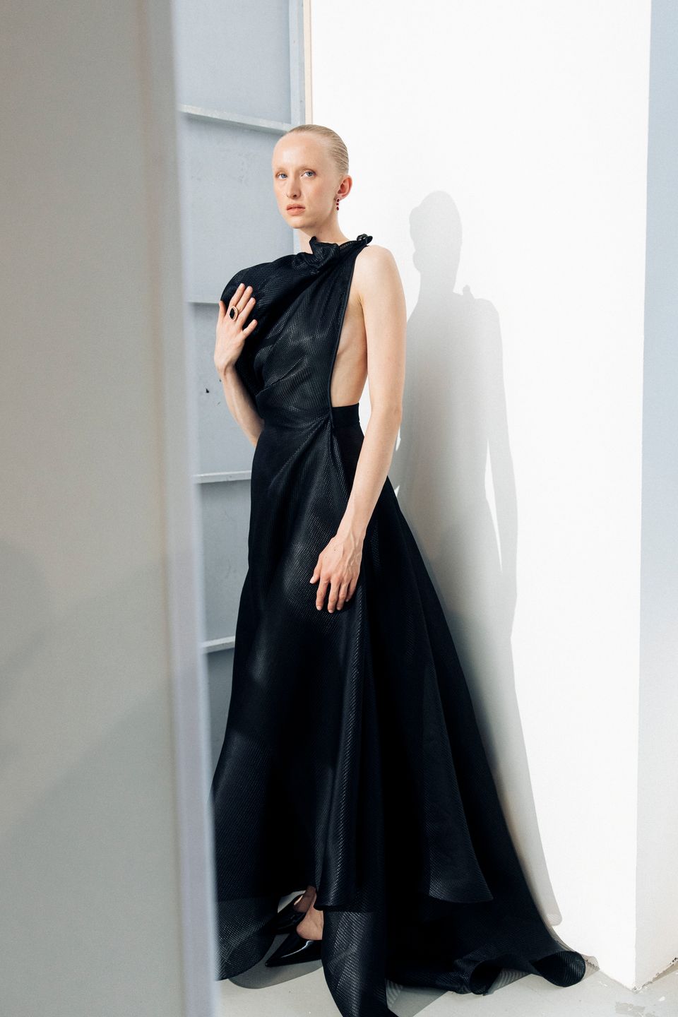 Model posing in a black gown